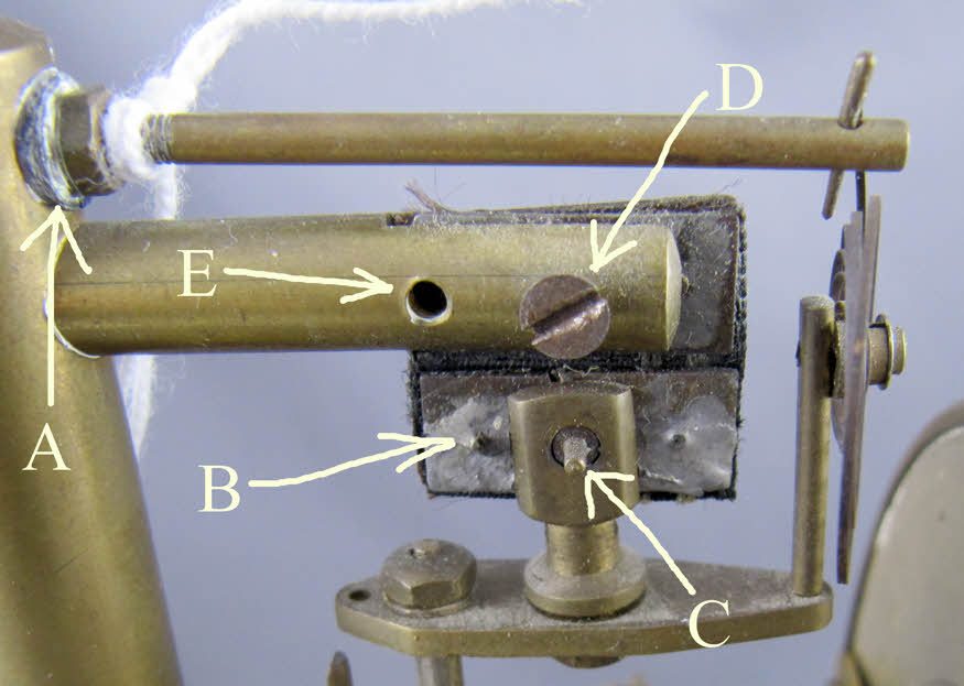 Bulle movement parts with white powdery Brasso residue marked