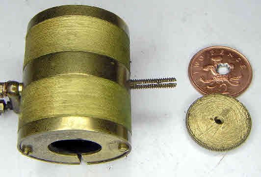 A Bulle coil with its rating nut cut down and a two-penny piece that had been added