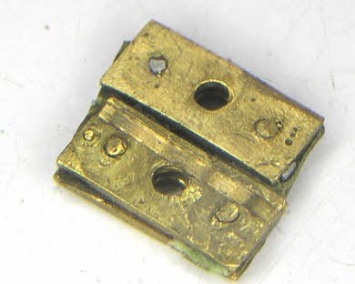 The broken remains of a Bulle suspension, crudely riveted together